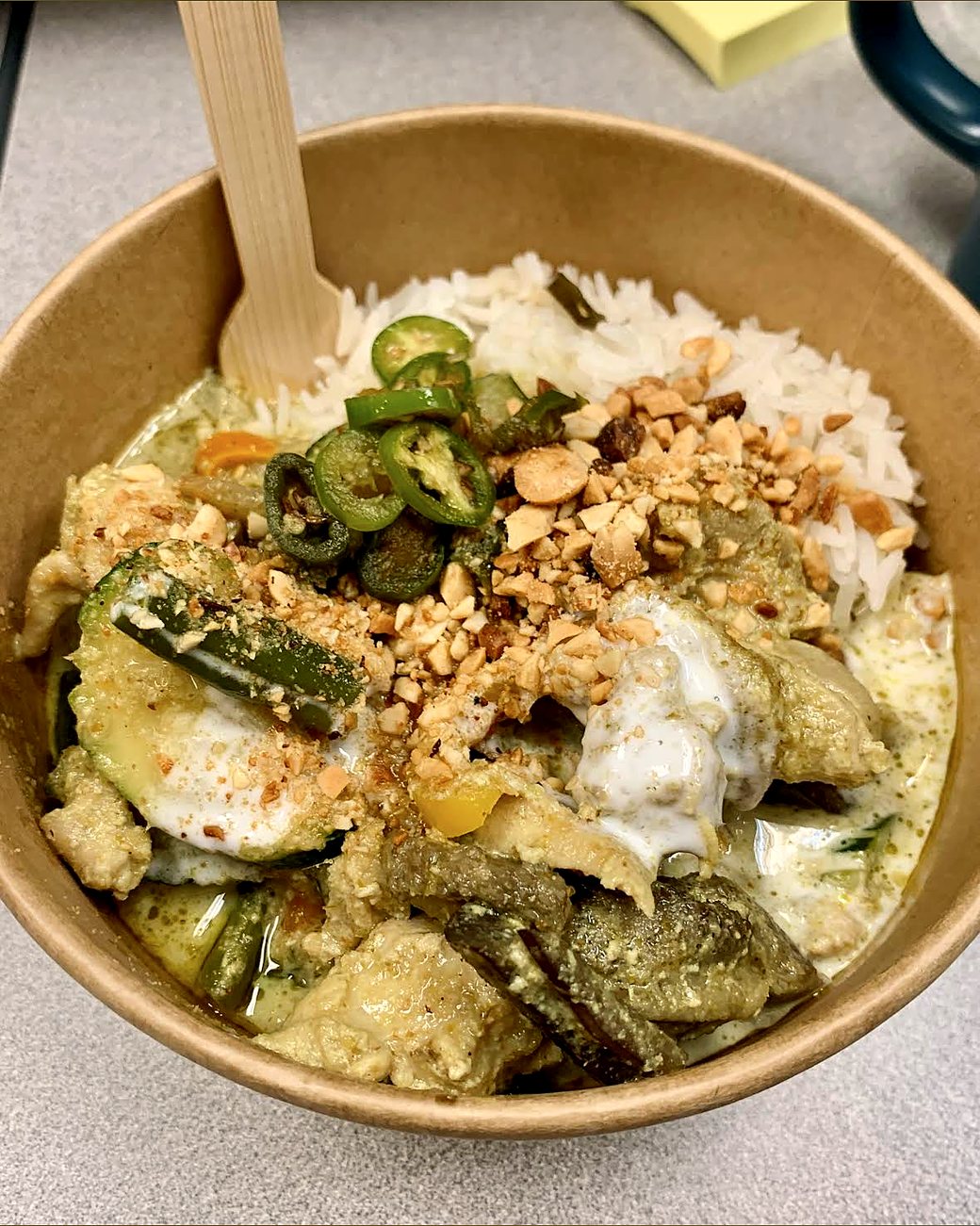 Green curry with chicken, zucchini, jalapeño and peanuts over jasmine rice